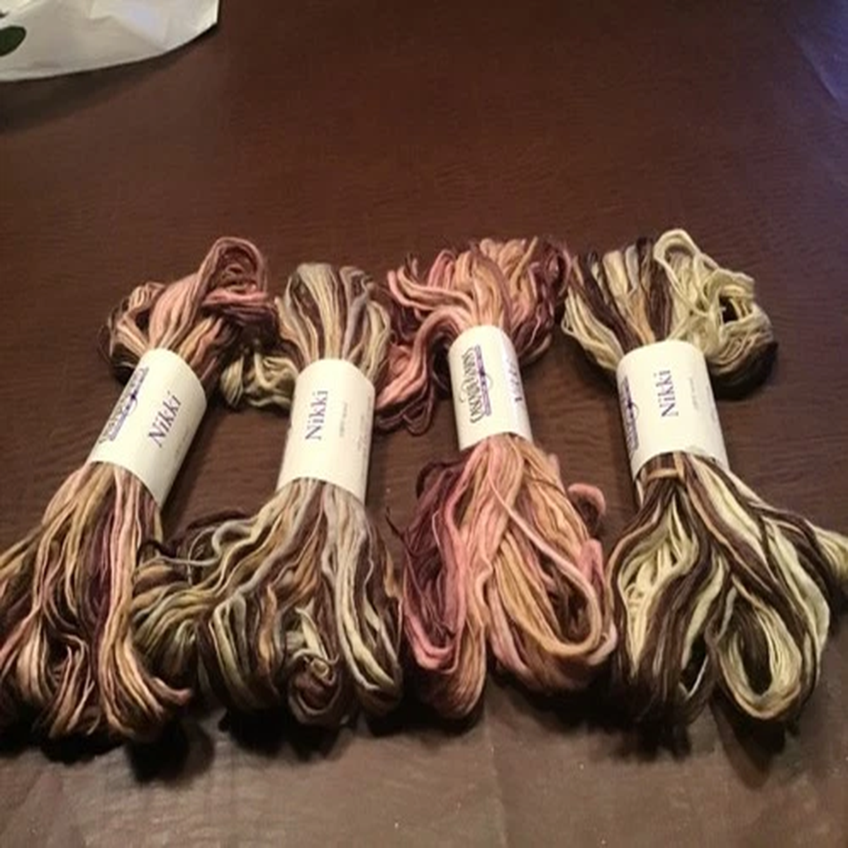 4 Yarn Skeins in Varied Colors. 100% Wool. 110 yds Per Skein and Made in Italy
