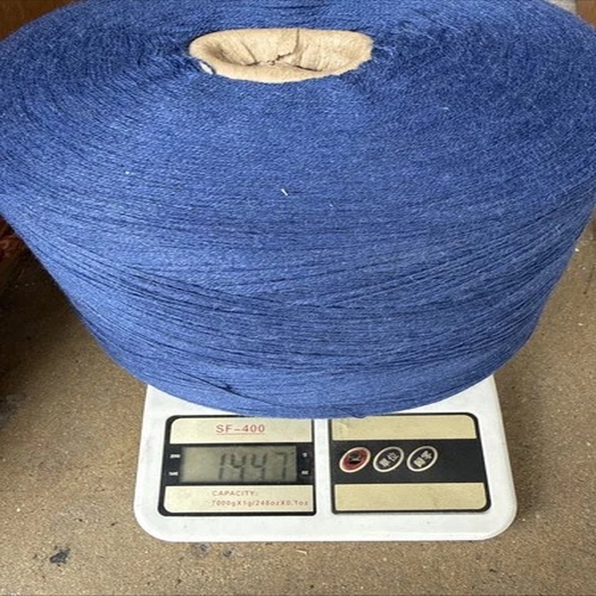 30% merino wool 70% cotton blend yarn cone in blue