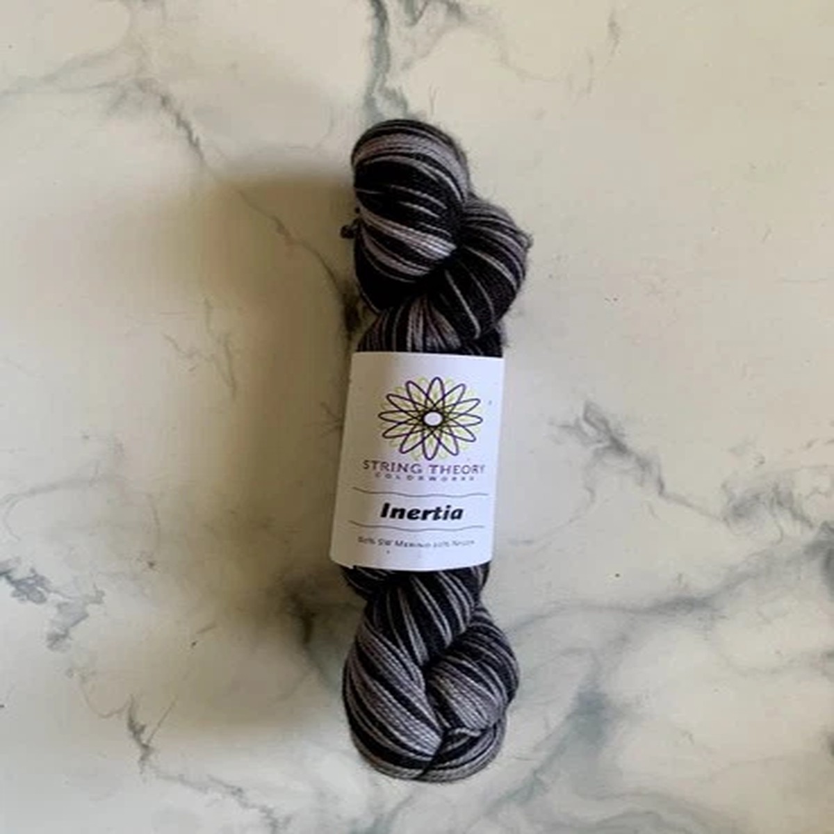 String Theory Colorworks Inertia Self-Striping Sock Yarn 80/20 Merino Gray Black